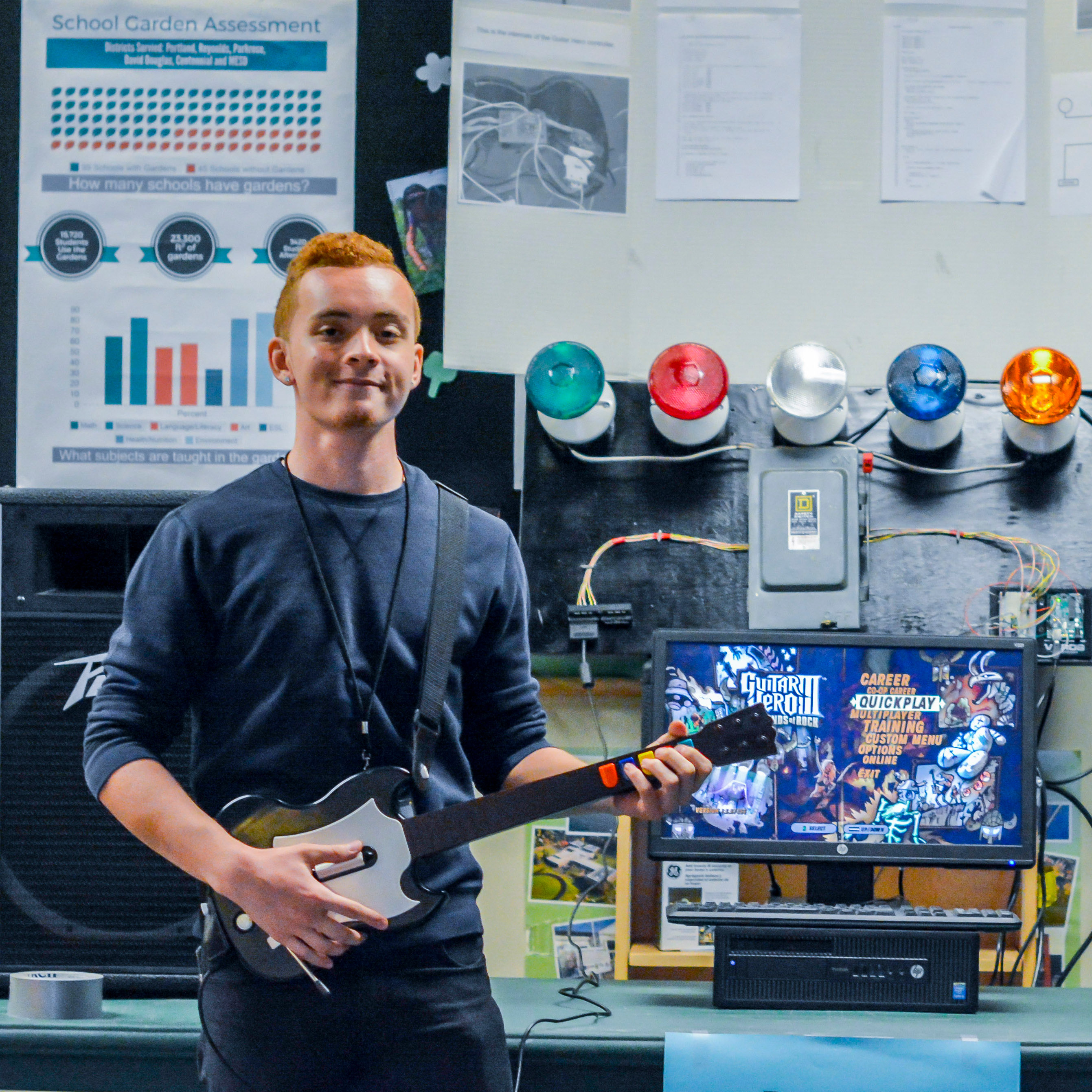 Sean holding a Guitar Hero Controller